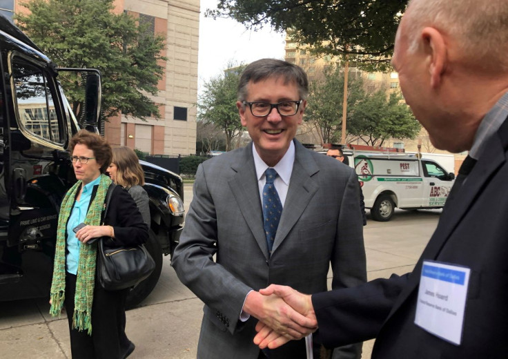 Federal Reserve Vice Chairman Richard Clarida, greets a member of the Dallas Fed staff before boarding a bus to tour South Dallas as part of a community outreach by U.S. central bankers, in Dallas, Texas, U.S., February 25, 2019.   