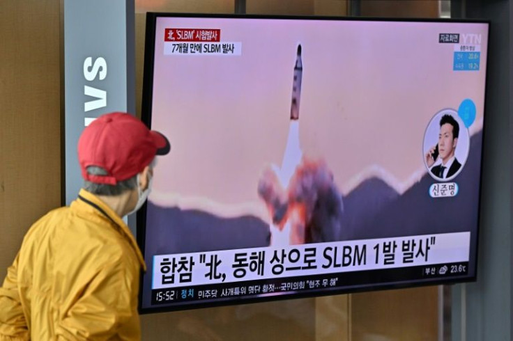 A television in Seoul shows a news report on the missile launch