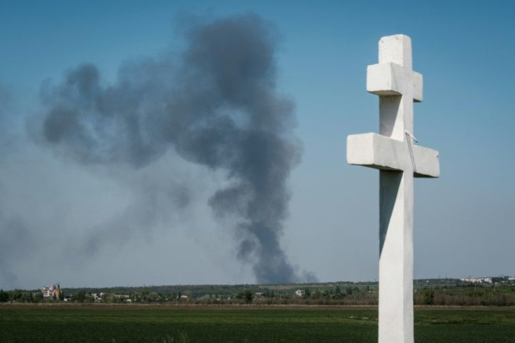 Smoke rising in the sky is pictured from Paraskoviivka, eastern Ukraine