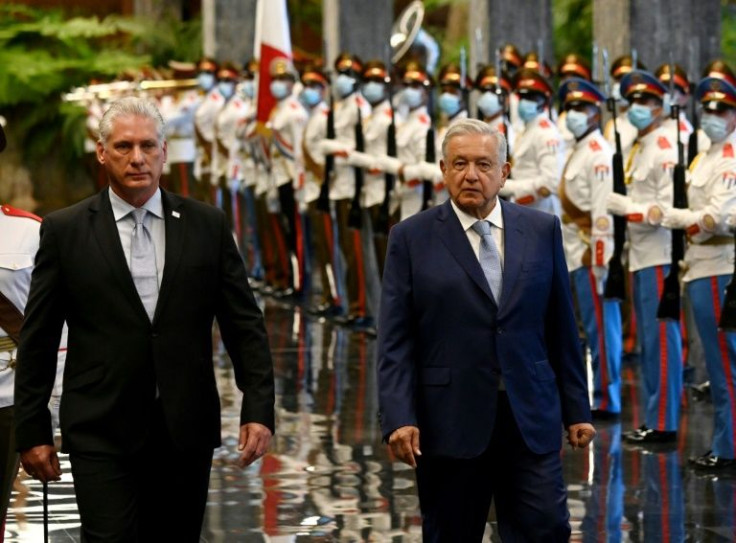 Mexican President Andres Manuel Lopez Obrador (R) was received with military honors by his Cuban counterpart Miguel Diaz Canel