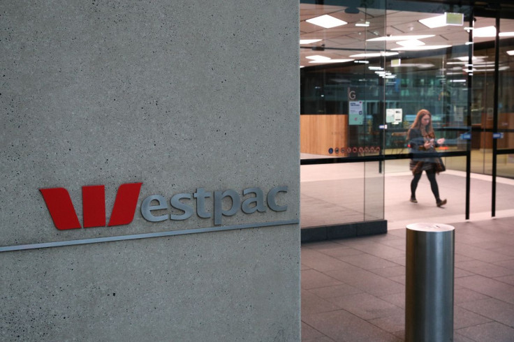 A woman exits the ground floor of an office building with Westpac logo amidst the easing of the coronavirus disease (COVID-19) restrictions in the Central Business District of Sydney, Australia, June 3, 2020. Picture taken June 3, 2020.