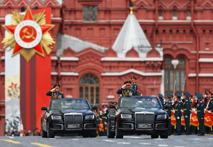 Russian Defence Minister Sergei Shoigu and Chief of the Russian Land Forces Oleg Salyukov drive Aurus cabriolets during a military parade on Victory Day, which marks the 77th anniversary of the victory over Nazi Germany in World War Two, in Red Square in