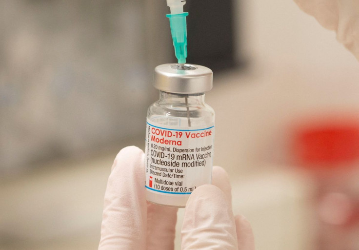 A healthcare worker fills up a syringe with a dose of Moderna's COVID-19 vaccine for a booster shot at the vaccination reference center at the Epidemiology, Biostatistics and Prevention Institute (EBPI) in Zurich, Switzerland November 17, 2021. 