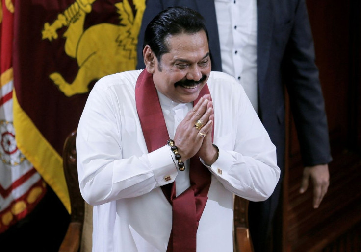 Sri Lanka's former leader Mahinda Rajapaksa, who was appointed as the new Prime Minister, gestures during the swearing in ceremony in Colombo, Sri Lanka Novermber 21, 2019.