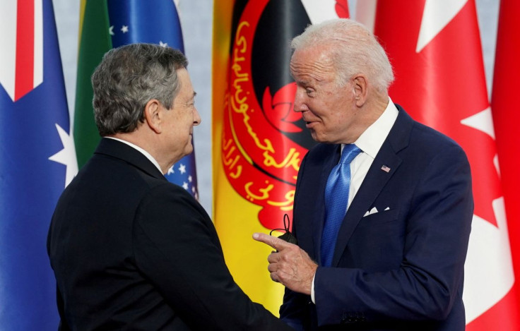 U.S. President Joe Biden is greeted by Italian Prime Minister Mario Draghi as he arrives for the G20 leaders' summit in Rome, Italy October 30, 2021.