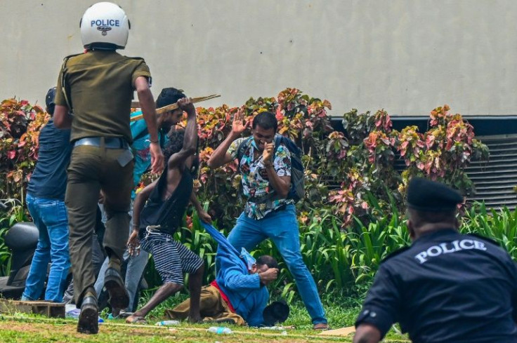Scores of Rajapaksa loyalists attacked unarmed protesters camping outside the president's office in downtown Colombo