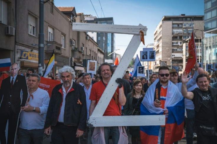 A man at the Belgrade march carried a large letter 'Z', the mark of Russia's invasion of Ukraine