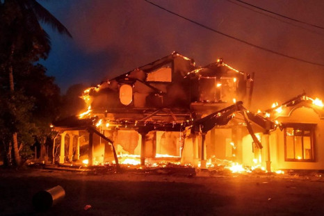 Anti-government demonstrators set fire on the house owned by minister Sanath Nishantha of resigned Prime Minister Mahinda Rajapaksa's cabinet after ruling party supporters stormed anti-govt protest camp, amid the country's economic crisis, in Arachchikatt