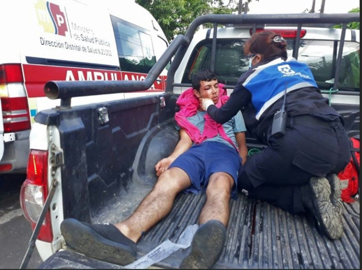 An injured inmate is transfered by truck to a medical facility following the riot at the Bellavista prison in Santo Domingo de los Colorados