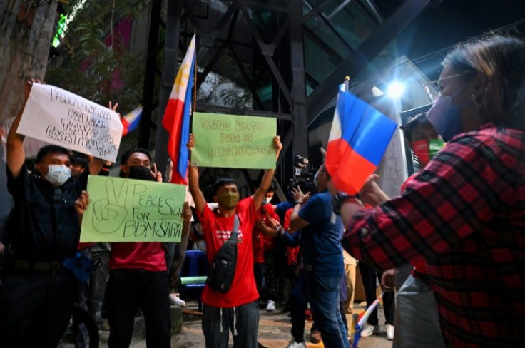 Supporters of Ferdinand Marcos Junior, who won the Philippines presidency in a landslide, celebrated the initial results outside the campaign's headquarters in Manila