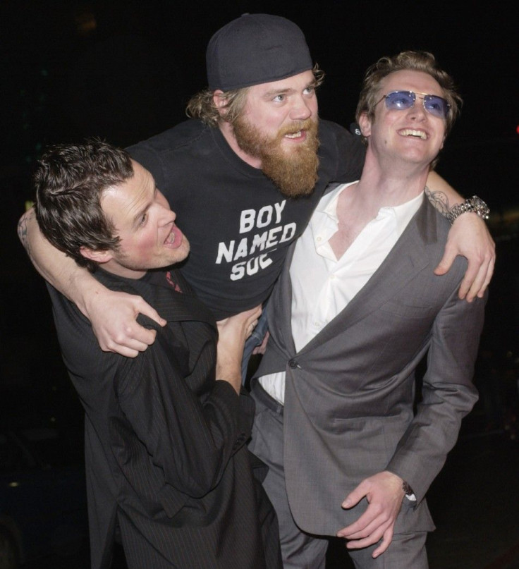 Steven Green (L), the director of &quot;Gumball 3000 - The Movie,&quot; cast member Ryan Dunn (C) and Maximillion Cooper, who launched &quot;Gumball 3000&quot; in 1999, ham it up for photographers during the premiere of the film at Grauman&#039;s Chinese 