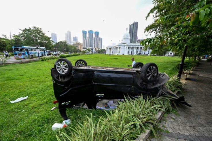 A day of violence between pro- and anti-government crowds saw cars and buses destroyed in the Sri Lankan capital Colombo on May 9, 2022