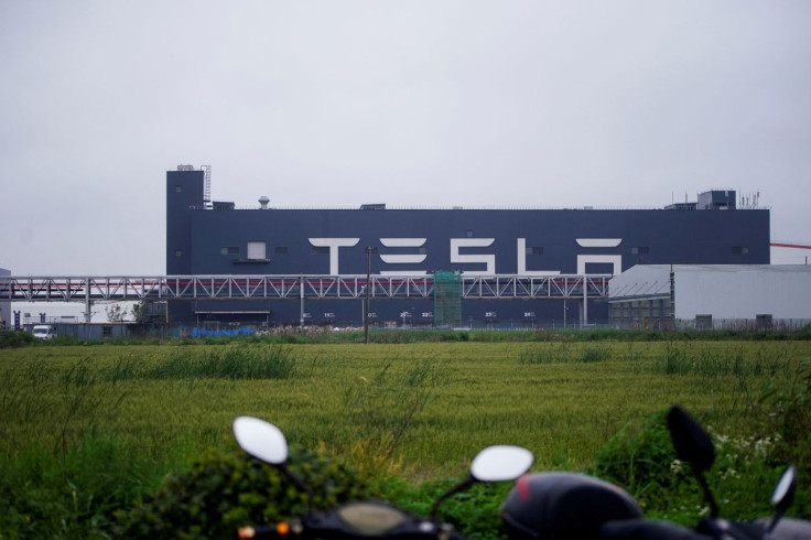 A Tesla sign is seen at its factory in Shanghai, China, May 13, 2021. 