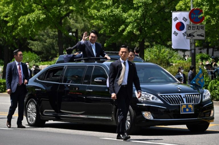 South Koreaâs President Yoon Suk-yeol waves from his car after his inauguration ceremony at the National Assembly in Seoul