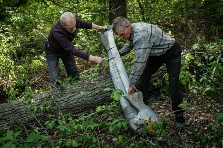A man-sized tail of an Uragan missile a few steps from the Lysychansk spring offers a stark reminder of the dangers lurking overhead