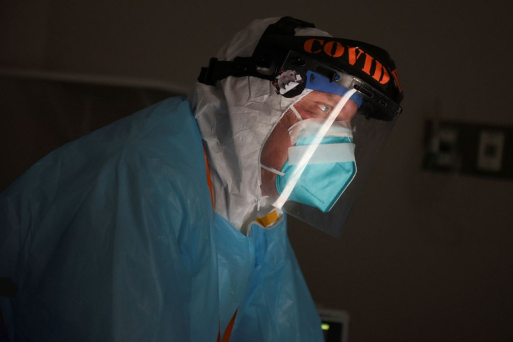 Dr. Joseph Varon checks on a patient as medical professionals treat people infected with the coronavirus disease (COVID-19) at United Memorial Medical Center in Houston, Texas, U.S., November 12, 2020.  