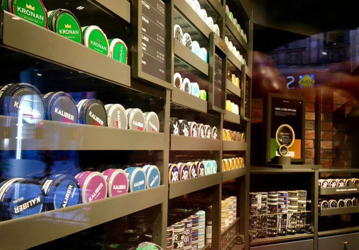 Moist powder tobacco "snus" cans are seen on shelves at a Swedish Match store in Stockholm, Sweden October 24, 2018. Picture taken October 24, 2018. 