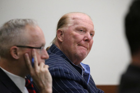Celebrity chef Mario Batali listens at Boston Municipal Court on the second day of his trial, in Boston, Massachusetts, U.S., May 10, 2022. Stuart Cahill/Pool via REUTERS