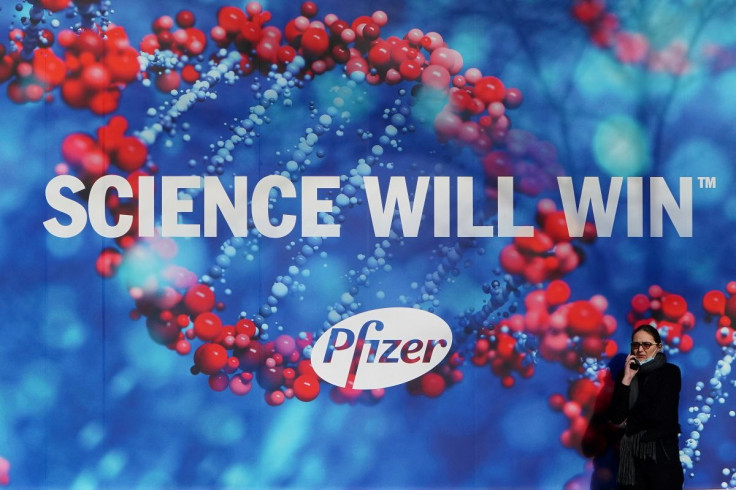 A person walks past the Pfizer Headquarters building in the Manhattan borough of New York City, New York, U.S., December 7, 2020.