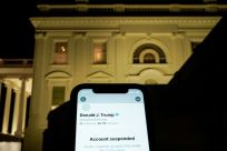 A photo illustration shows the suspended Twitter account of U.S. President Donald Trump on a smartphone and the White House in Washington, U.S., January 8, 2021.  
