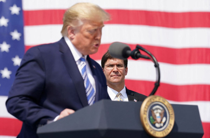 U.S. President Donald Trump speaks near U.S. Defense Secretary Mark Esper during a send off for the Navy hospital ship USNS Comfort at Naval Station Norfolk, in Norfolk, Virginia, U.S. March 28, 2020.