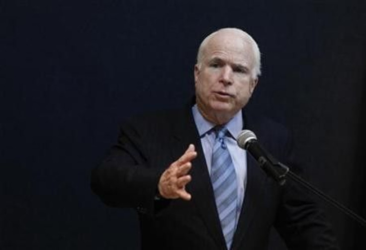 Senator John McCain talks to reporters during a news conference at the American Centre in Yangon June 3, 2011.
