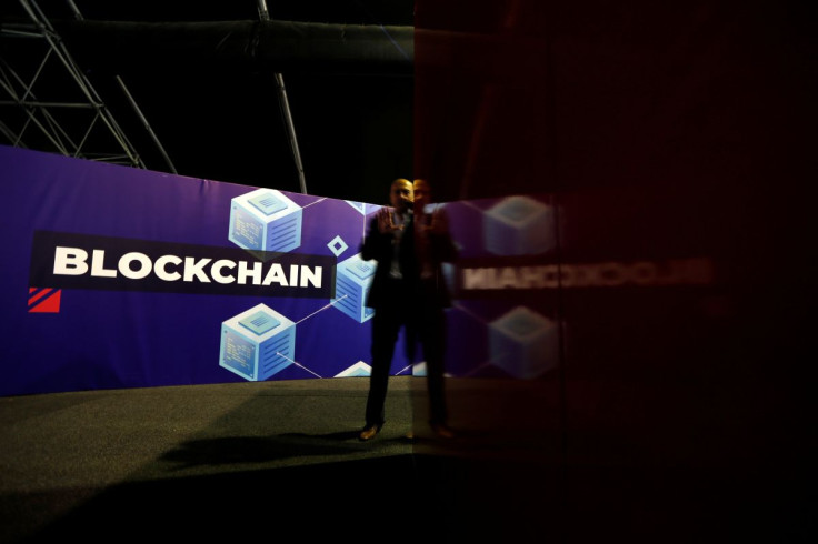 A delegate talks on his phone at the Delta Summit, Malta's official Blockchain and Digital Innovation event promoting cryptocurrency, in Ta' Qali, Malta October 3, 2019.