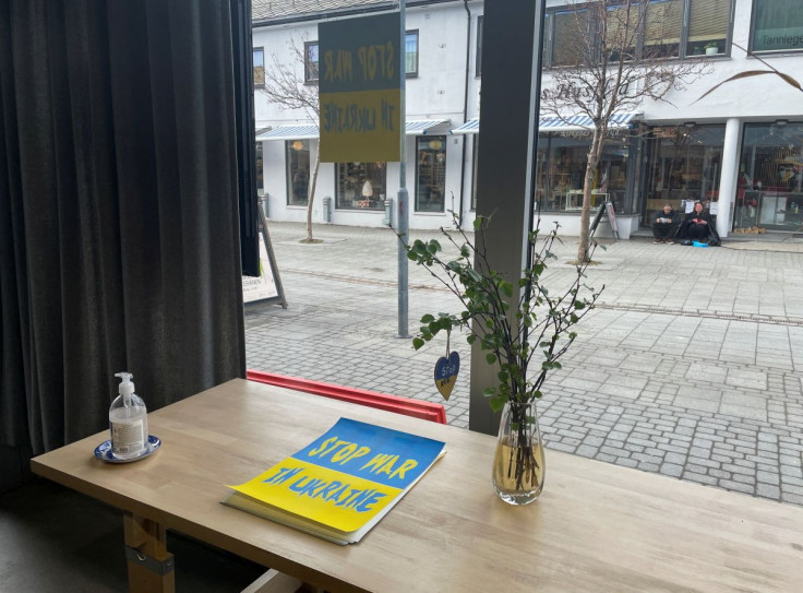Posters protesting the war in Ukraine are displayed in an art gallery in the Norwegian Arctic town of Kirkenes, Norway, May 9, 2022.