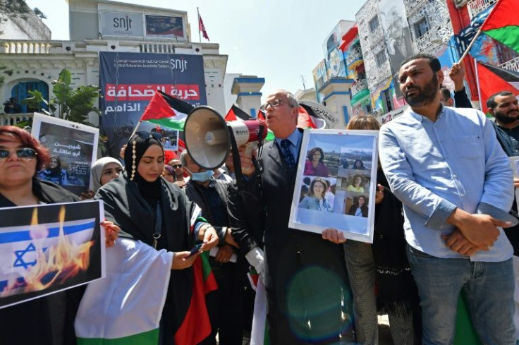 Tunisian journalists protest the death of veteran Al Jazeera Palestinian journalist Shireen Abu Akleh, in Tunis on May 11, 2022