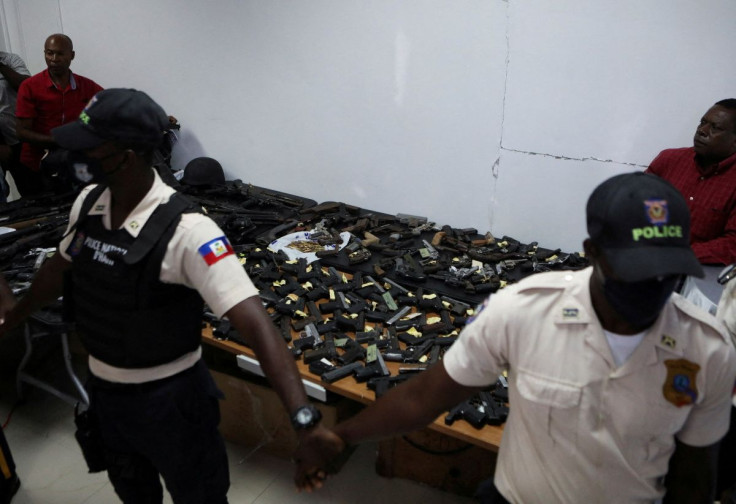 Weapons confiscated in police operations against increasingly powerful gangs are presented to the media, after at least 75 people have been killed in turf wars that broke out two weeks ago between gangs, according to the United Nations Integrated Office i
