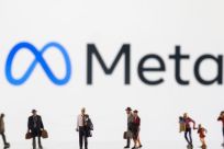 Small figurines are seen in front of displayed Meta logo in this illustration taken February 11, 2022. 