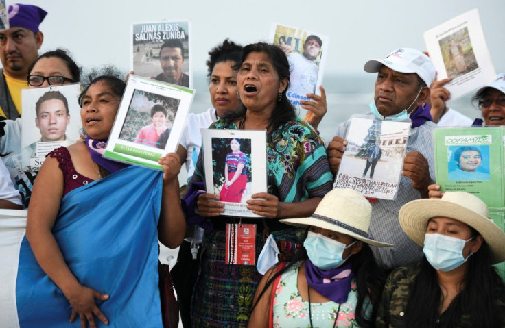 Central American Mothers and other relatives hold up pictures of migrants who disappeared while traveling trying to reach the U.S. border, during a demonstration in Veracruz, Mexico May 6, 2022. Picture taken May 6, 2022.