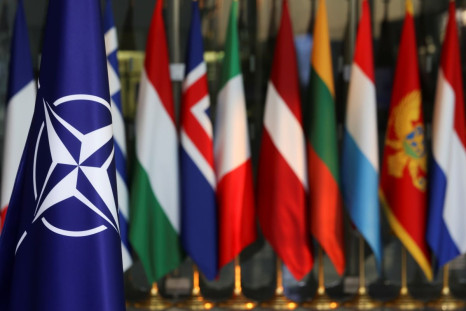 National flags of members of the NATO are seen, on the day of a foreign ministers meeting amid Russia's invasion of Ukraine, at the Alliance's headquarters in Brussels, Belgium March 4, 2022. 