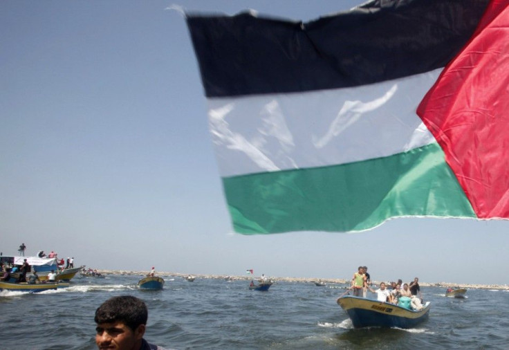Palestinians ride boats in the Mediterranean Sea off the coast of Gaza City