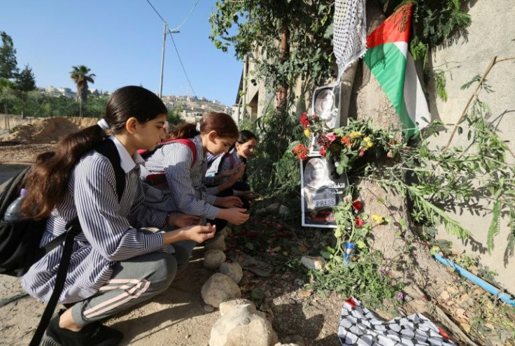 School girls visit the site where veteran Al Jazeera Palestinian journalist Shireen Abu Akleh was shot dead while covering an Israeli army raid in the occupied West Bank, in Jenin on May 12, 2022