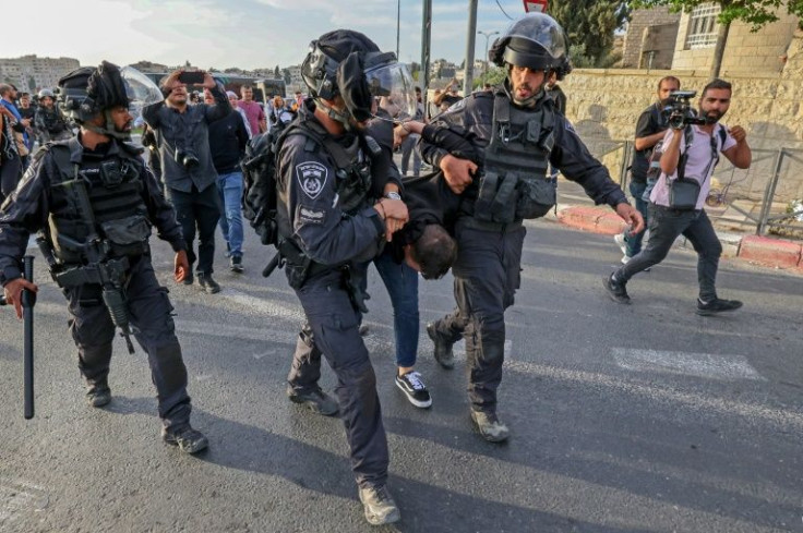 Israeli security forces detain a Palestinian during a protest condemning the death of Shireen Abu Akleh in the Palestinian neighbourhood of Beit Hanina in Israeli-annexed east Jerusalem on May 11, 2022