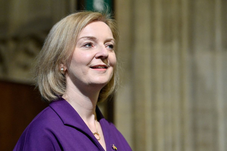 Britain's Foreign Secretary Liz Truss reacts as she walks through the Central Lobby at the Palace of Westminster, ahead of the State Opening of the Parliament, at the Houses of Parliament, in London, Britain May 10, 2022. Justin Tallis/Pool via REUTERS