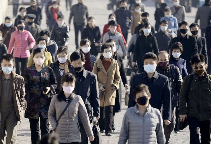 People wearing protective face masks commute amid concerns over the new coronavirus disease (COVID-19) in Pyongyang, North Korea March 30, 2020, in this photo released by Kyodo. Picture taken March 30, 2020. Mandatory credit Kyodo/via REUTERS