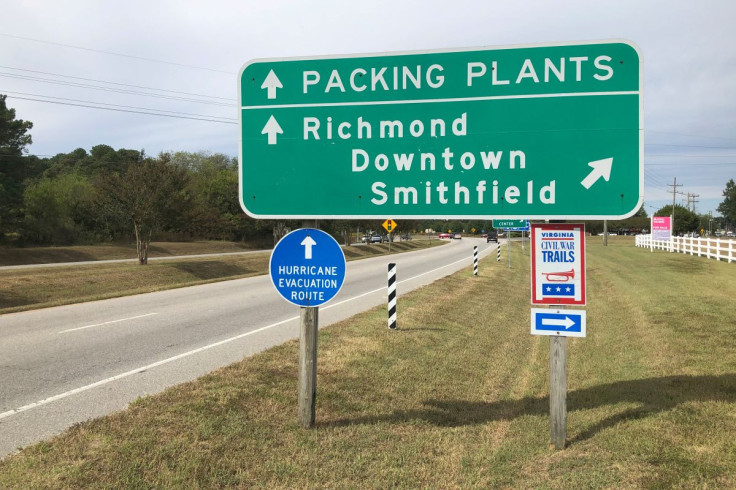 A road sign directs traffic to Smithfield Foods' pork processing facilities in Smithfield, Virginia, U.S. October 17, 2019. Picture taken October 17, 2019.