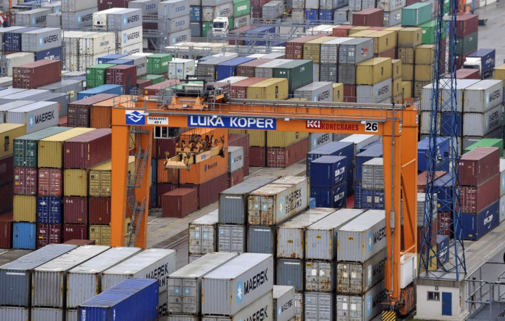 A crane is pictured next to lined up containers at the Port of Koper January 14, 2014. 