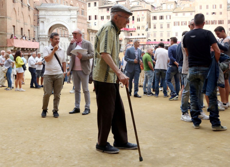 An elderly man walks in the old city centre of Siena, Italy June 30, 2017. 