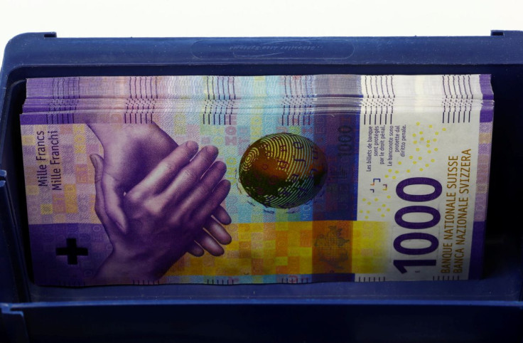 1,000-Swiss-franc banknotes lie in a box at a Swiss bank in Zurich, April 9, 2019.