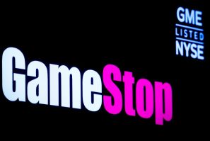A screen displays the logo and trading information for GameStop on the floor of the New York Stock Exchange (NYSE) in New York City, U.S., March 29, 2022.  