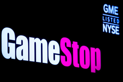A screen displays the logo and trading information for GameStop on the floor of the New York Stock Exchange (NYSE) in New York City, U.S., March 29, 2022.  