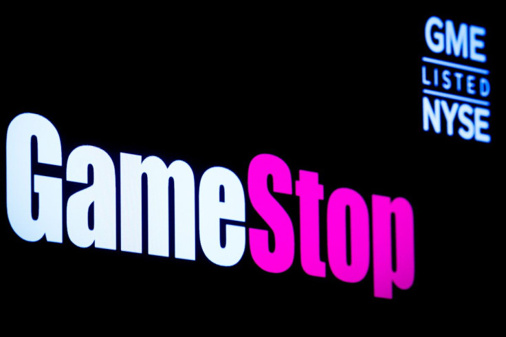 A screen displays GameStop's logo and trading information on the floor of the New York Stock Exchange (NYSE) in New York City, U.S., March 29, 2022.  