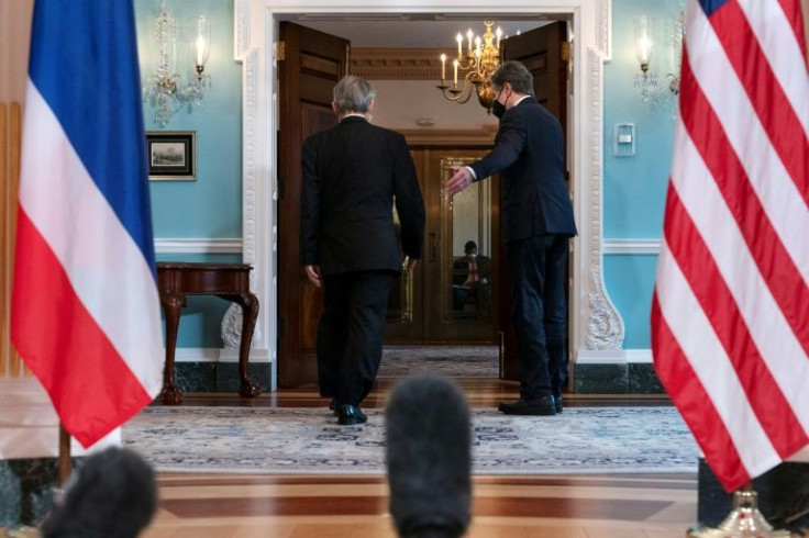 Secretary of State Antony Blinken (right) walks with Thailand's Foreign Minister Don Pramudwinai on the sidelines of a US-ASEAN Summit