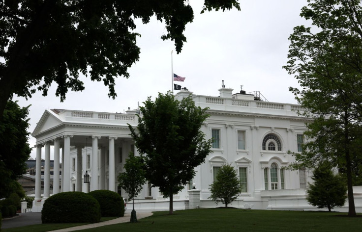 The American flag is seen flying at half staff over the White House to honor the 1 million U.S. citizens killed by COVID-19 since the pandemic began in Washington, U.S., May 12, 2022. 
