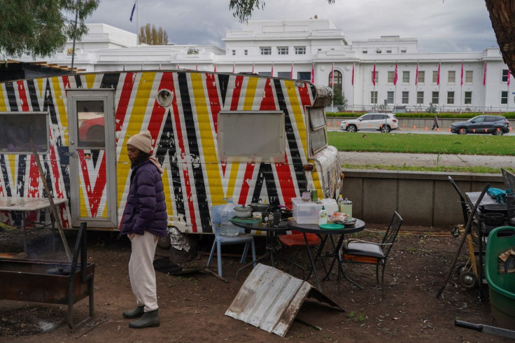 Gwenda Stanley, an Indigenous Australian of Gomeroi descent, boils water for tea at the Aboriginal Tent Embassy, a site of protest since 1972, in Canberra, Australia, May 4, 2022. Picture taken May 4, 2022.