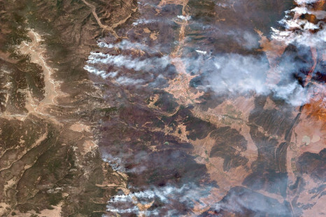 A satellite image shows a natural color overview of the Hermits Peak and Calf Canyon fires, near Las Vegas, New Mexico, U.S., May 12, 2022. Satellite image 2022 Maxar Technologies/Handout via REUTERS 