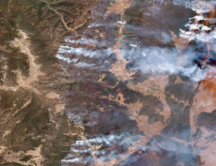 A satellite image shows a natural color overview of the Hermits Peak and Calf Canyon fires, near Las Vegas, New Mexico, U.S., May 12, 2022. Satellite image 2022 Maxar Technologies/Handout via REUTERS 